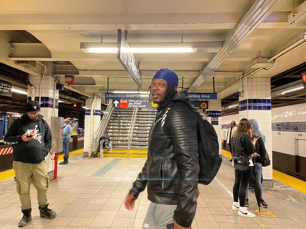 Marquise Hicks waits at the Jay Street-MetroTech station hoping to catch the F train to his job, only to find out trains aren't running.