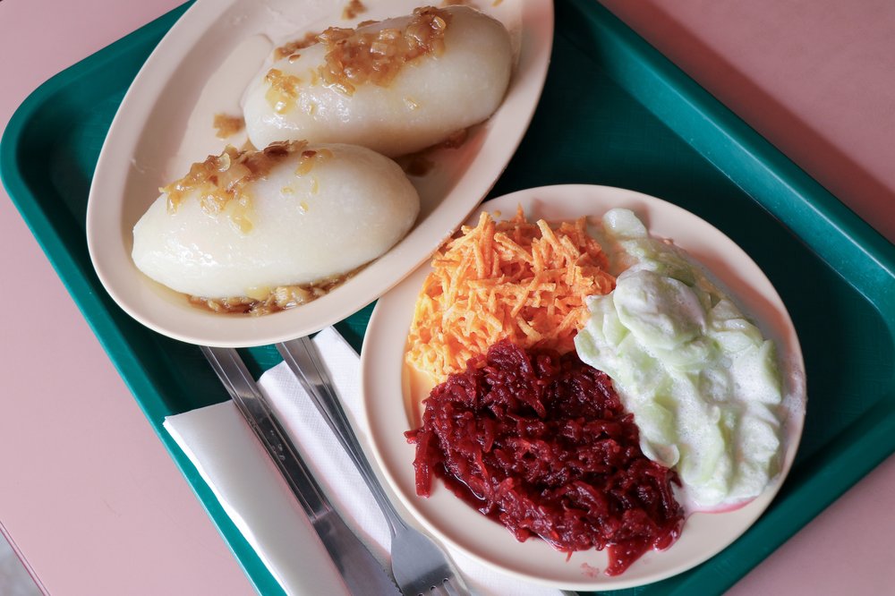 A tray filled with plates of food.