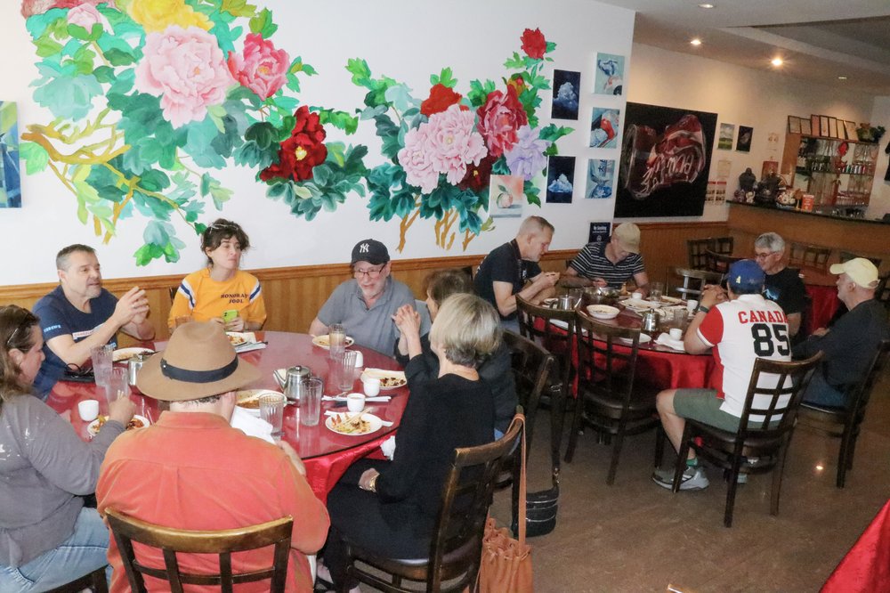 A group of people dine at a restaurant.