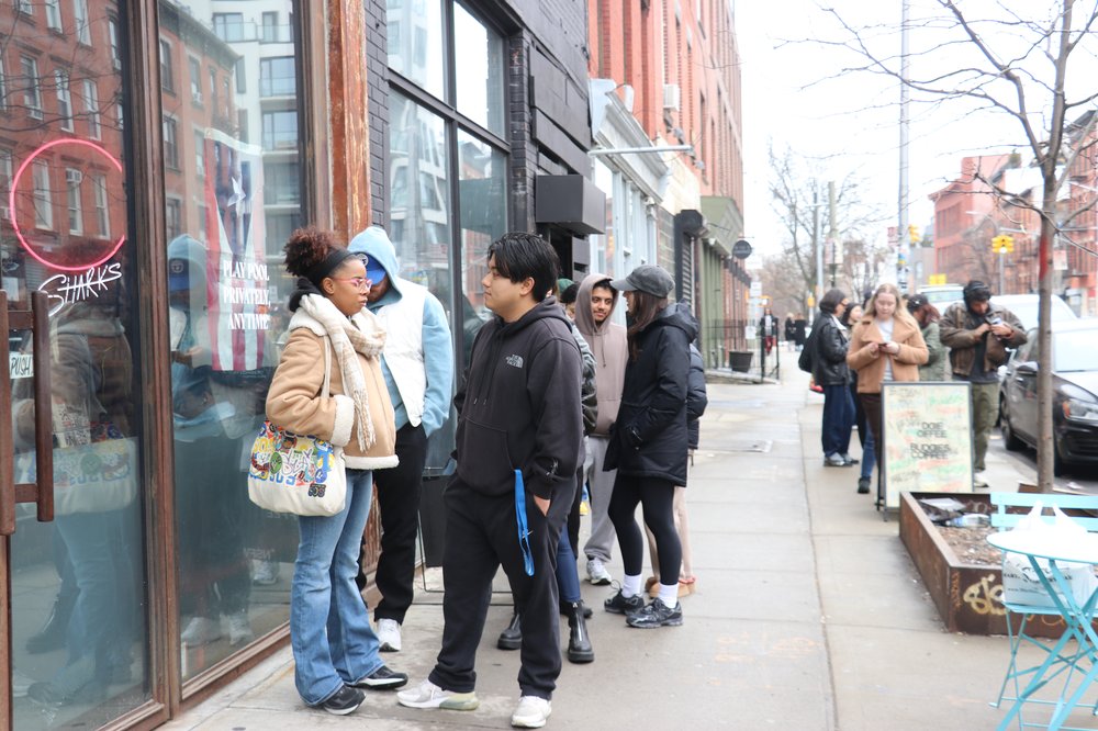 Customers line up out the door at Buddies Coffee after its owner said online she fears her hard work will be undone by increased rent and competition next door.