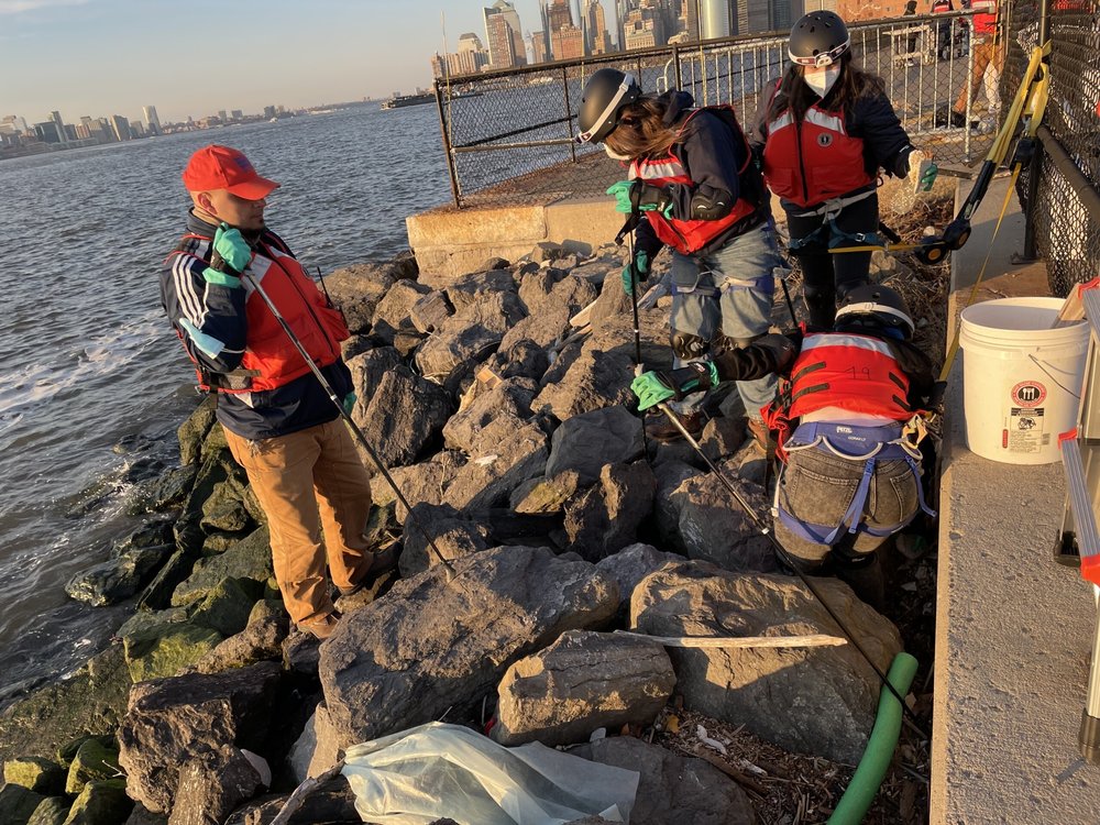 Students in the Harbor SEALs collect trash on the riprap that breaks the storm surge on Governors Island. They’re using the data in testimony before City Hall about ocean pollution.