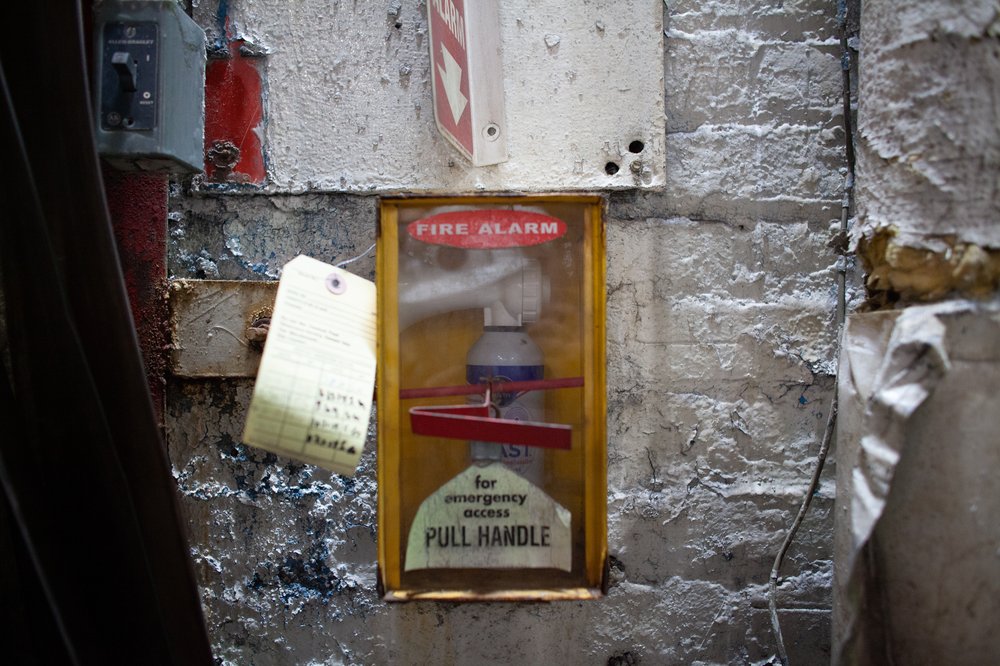 An air horn in a box nailed to the wall at 240th Street Yard.