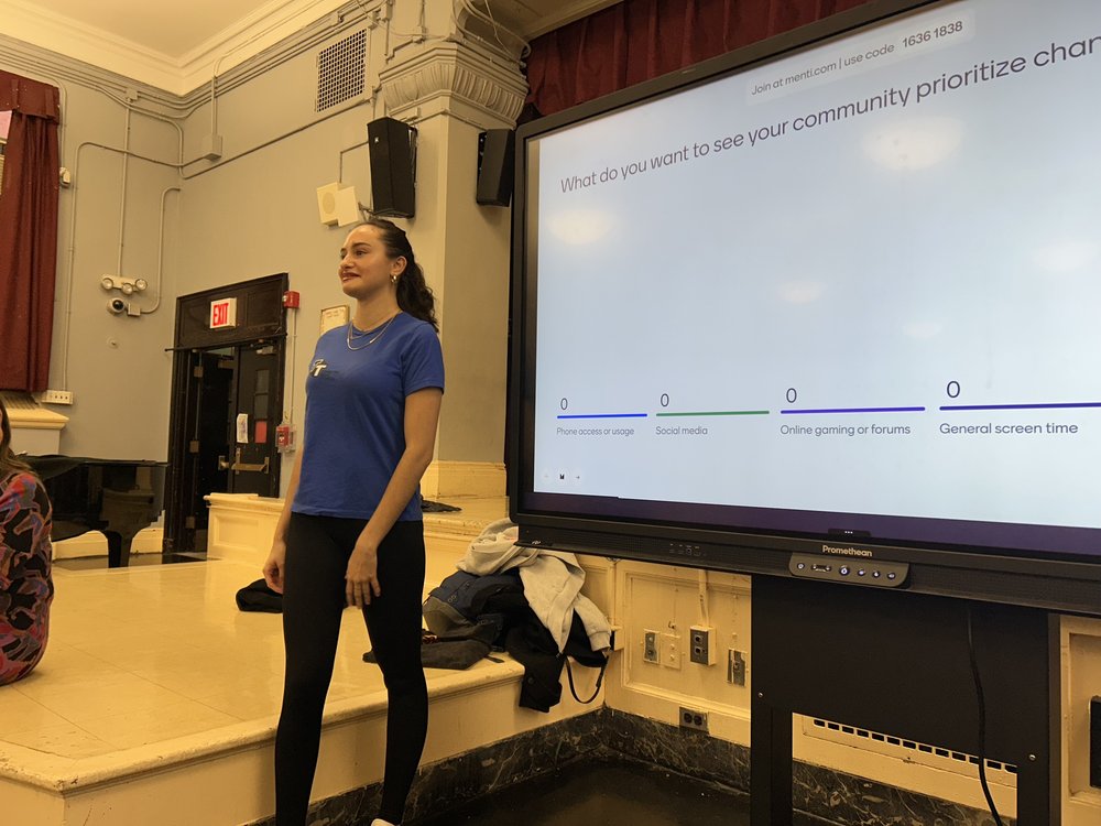A student gives a Powerpoint presentation.