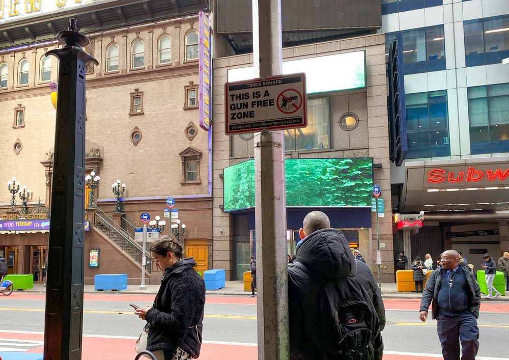 Gun free zone signs posted in Times Square.