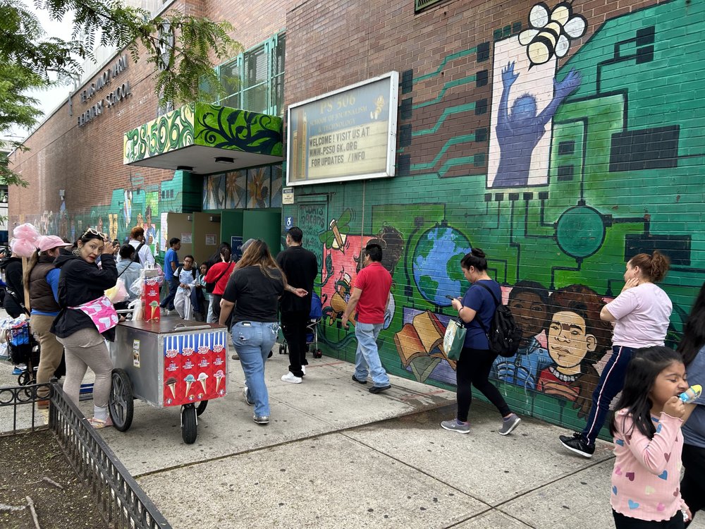 Parents line up to pick up kids from the afterschool program overseen by the Center For Family Life at PS 506 in Sunset Park, which has been supported with help from AmeriCorps, now facing cuts from the Trump Administration.