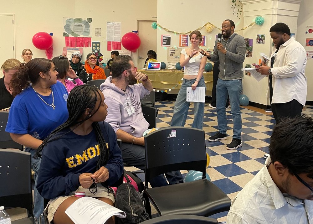 High school student Veronica Morris and adult ally Omari Soulfinger speaking at Youth Policy Party where ideas like the Youth Civic Hub become reality.