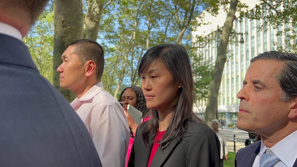 A couple leave a federal courthouse in Brooklyn.