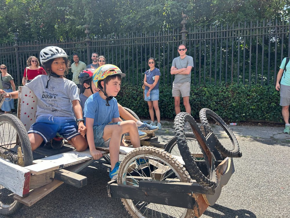 Kids try out their soapbox derby car in a trial race, as practice for this weekend's South Slope Derby in Brooklyn.