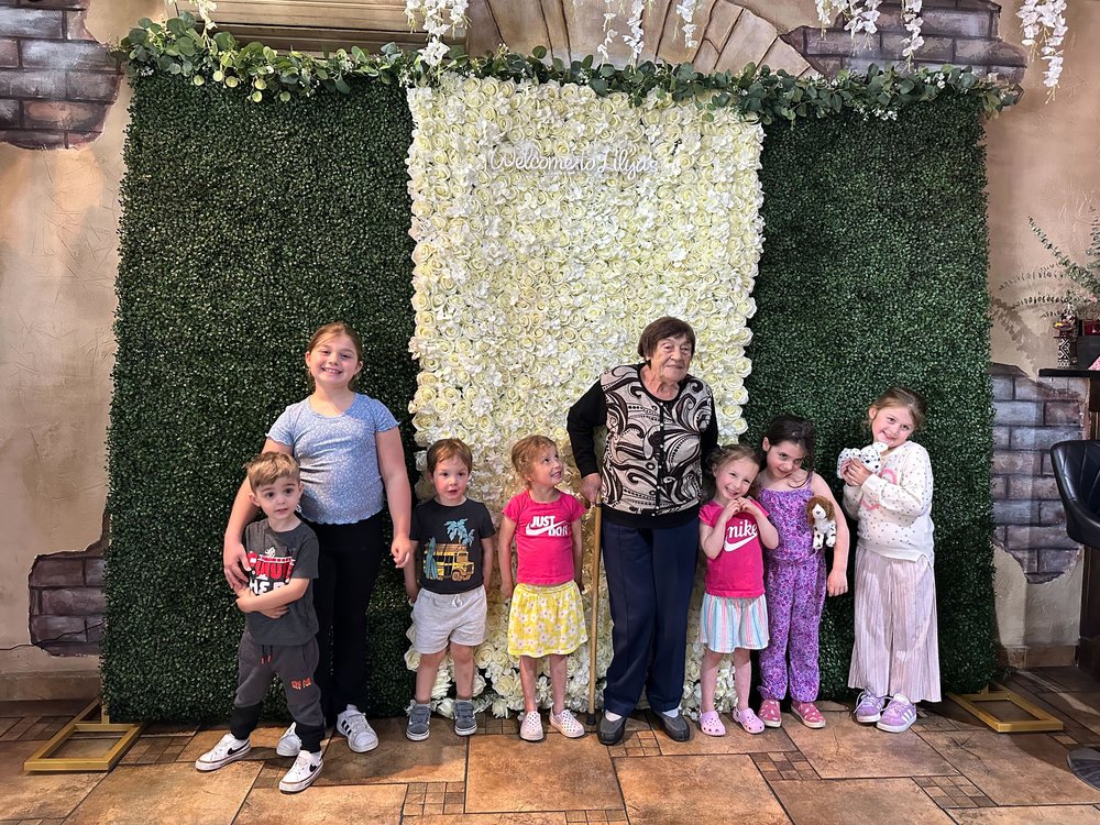 Mayya Gil photographed with her seven great grandchildren.