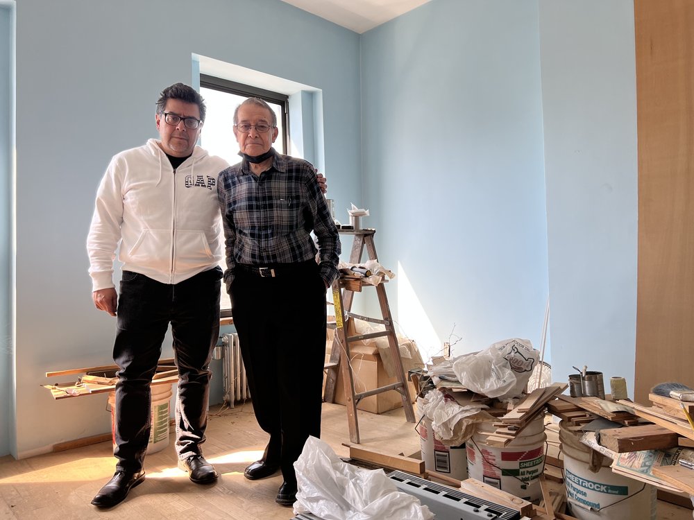 Ray Cortez (right) with his son, Ray Cortez Jr. (left), inside the Brooklyn brownstone he bought in 1969.