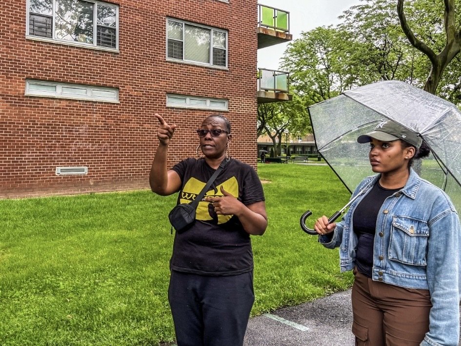 Rochdale Village residents Reaghan Smith and Imani Whitfield walk the grounds of their sprawling development.