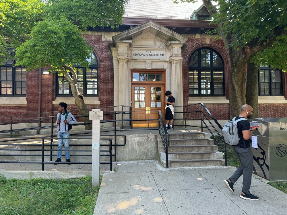 People idling outside of the St. George Library on Staten Island.