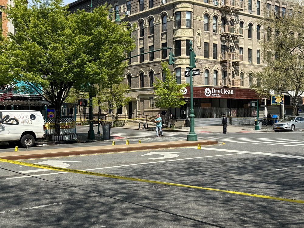 Police investigate the scene of a fatal shooting in Harlem on April 23, 2025.