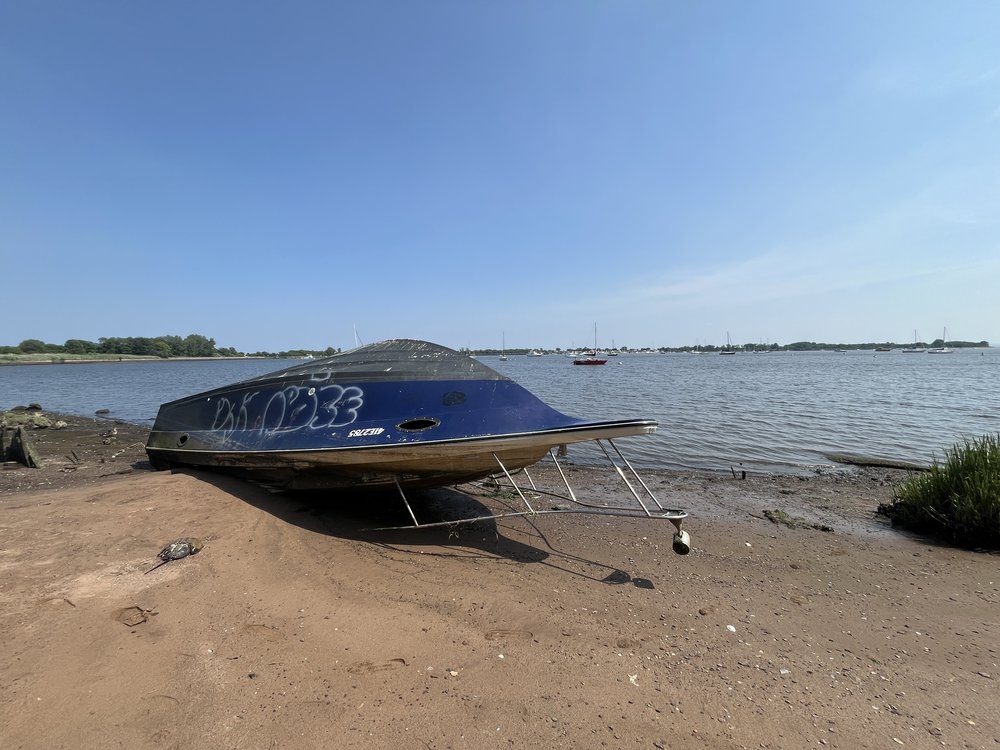 A boat turned over for storage on the shores of Great Kills Park on Staten Island.
