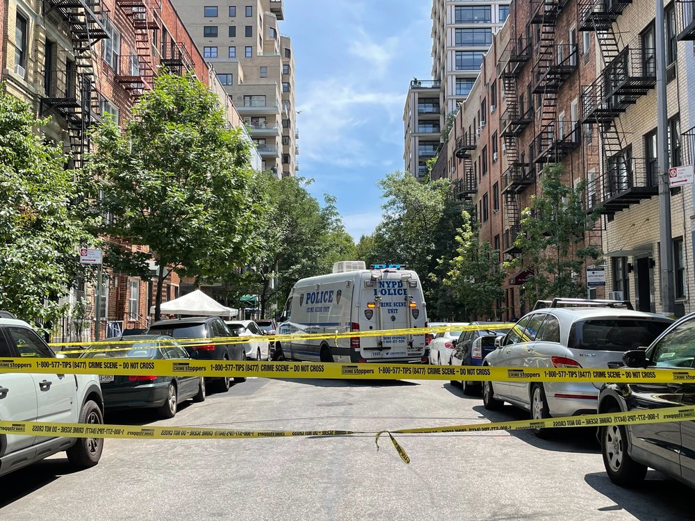 Police investigate a fatal double shooting in Yorkville on July 26, 2024.