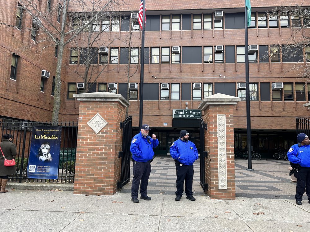 Officers stand outside of Edward R. Murrow High School in Midwood after a 15-year-old was stabbed there on Tuesday morning.