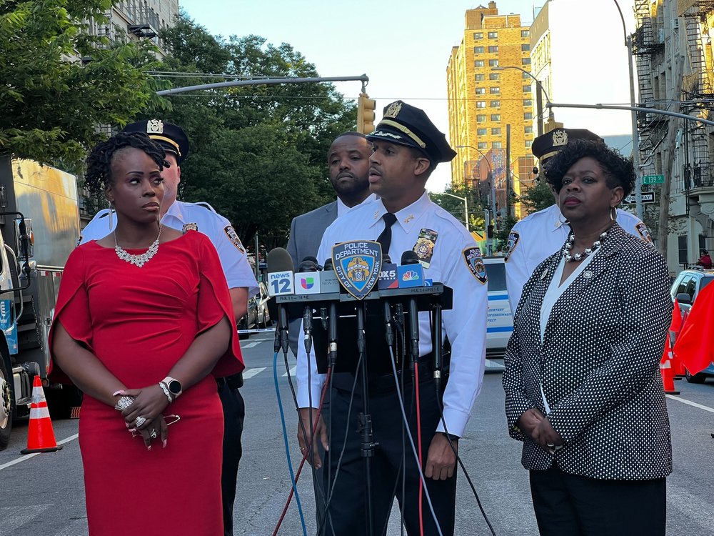 NYPD officials brief the media after a shooting on Thursday that police say killed a 71-year-old woman.