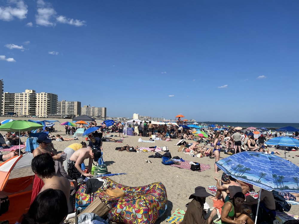 People relaxing on the beach.