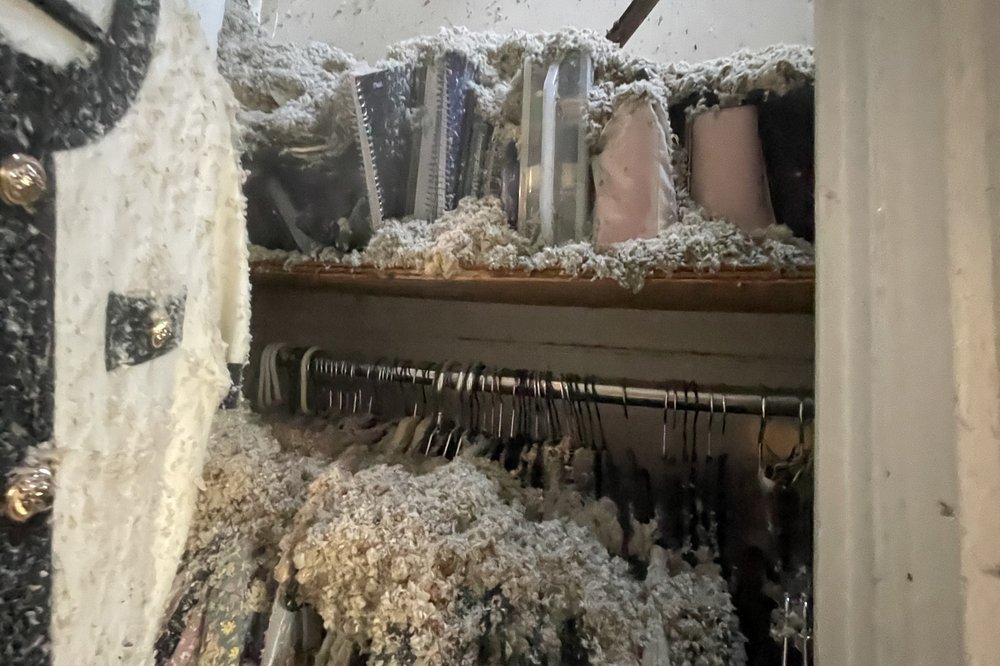 Items are covered with ash and debris following a fire.
