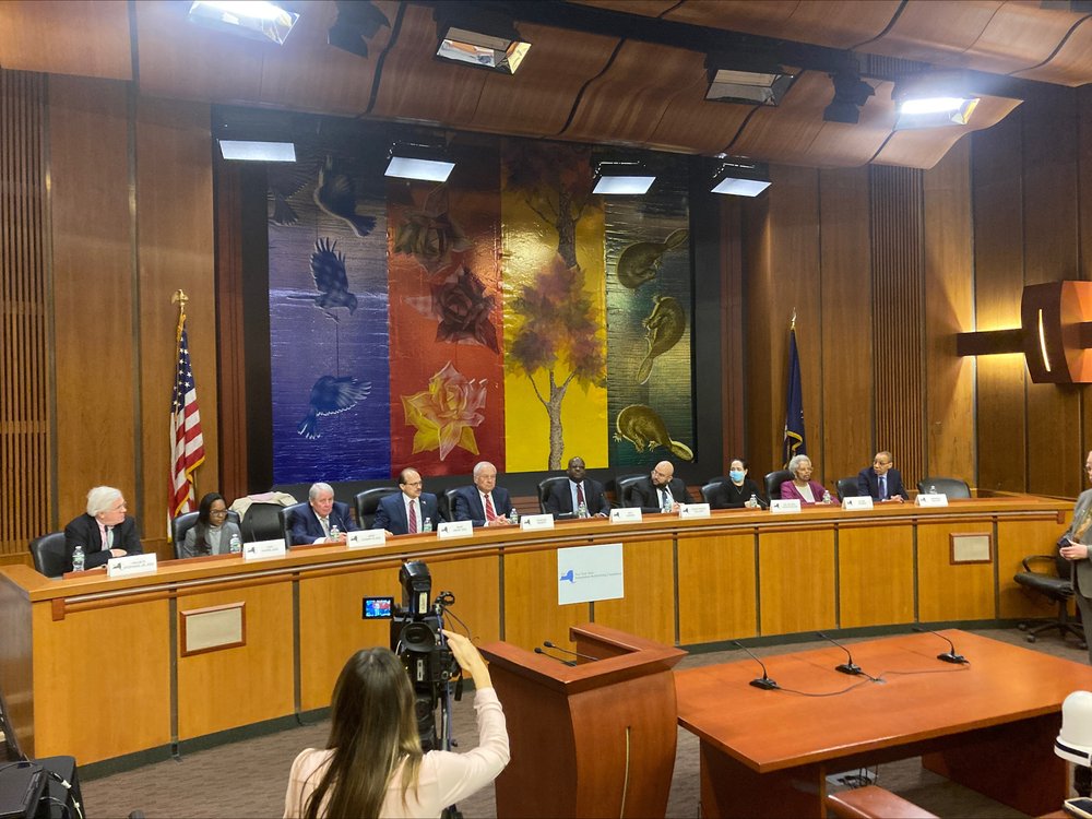 The 10-member Independent Redistricting Commission Panel in a hearing room in Albany.