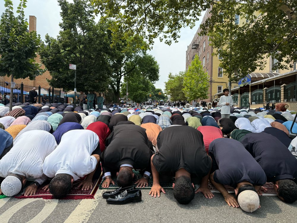 Men gather for prayer at the funeral service for slain officer Didarul Islam