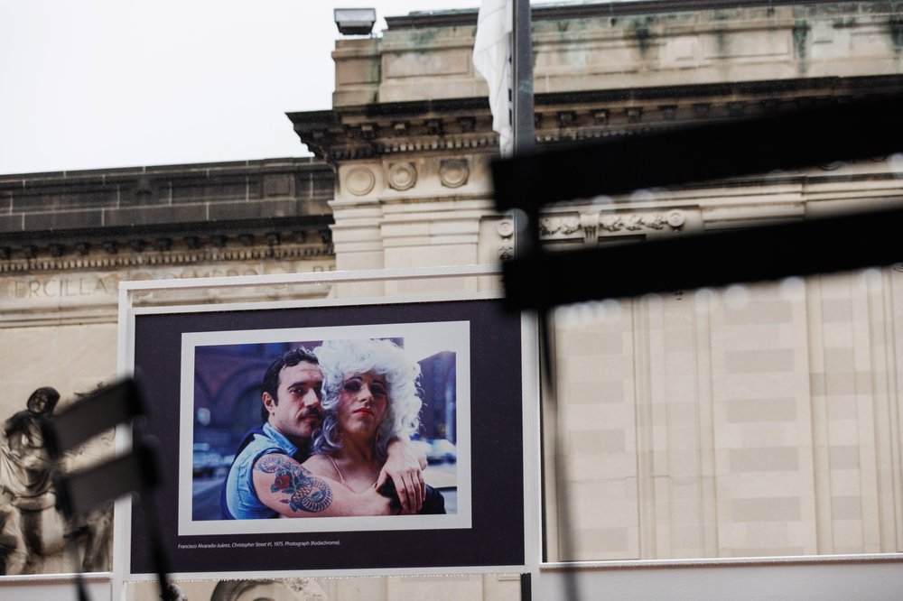 A picture of a couple embracing outside.