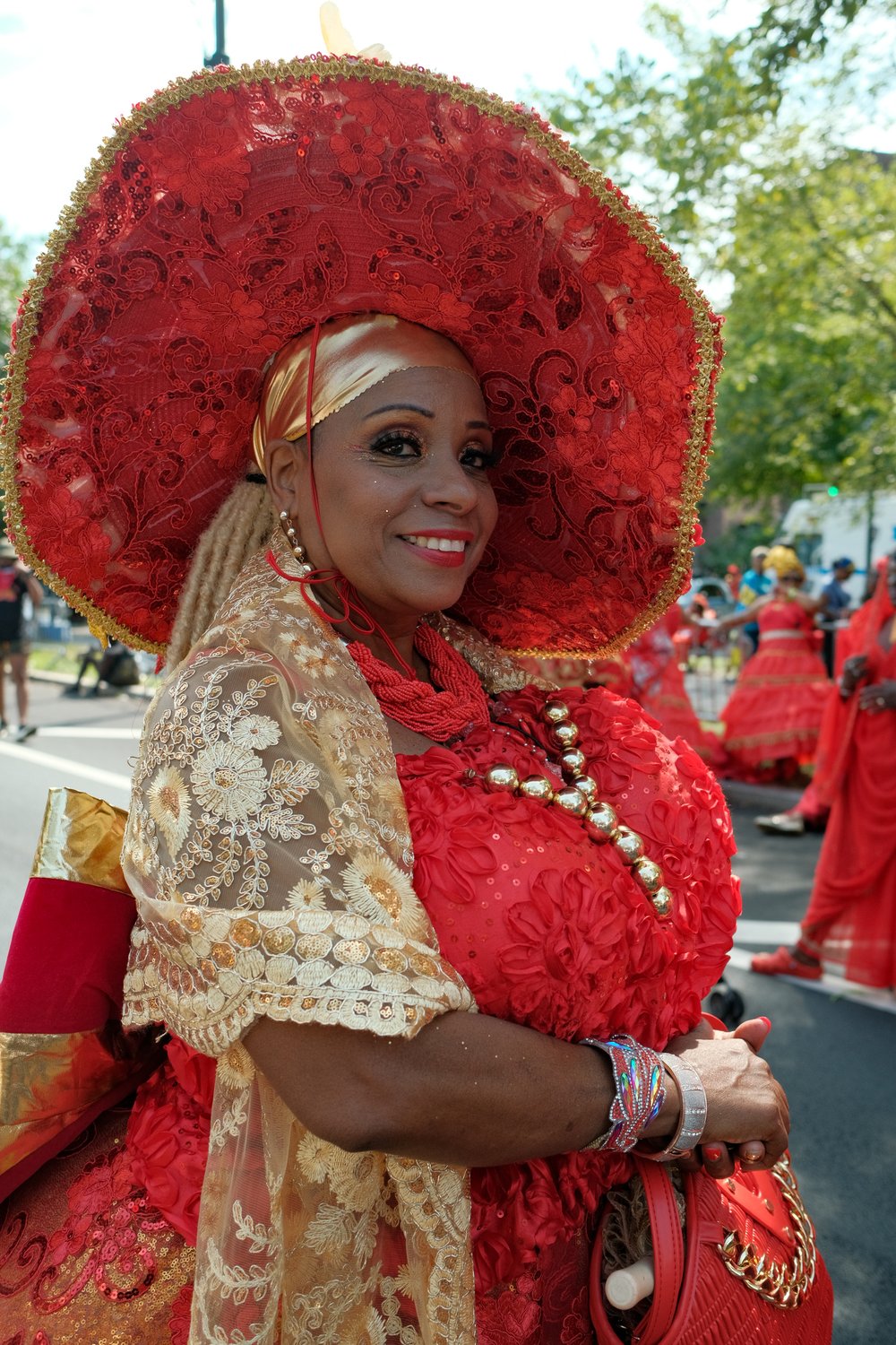 A woman in a colorful red costume.
