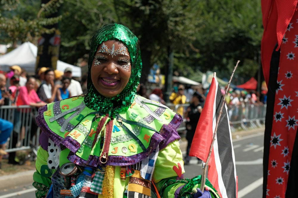 A woman in a colorful green costume.