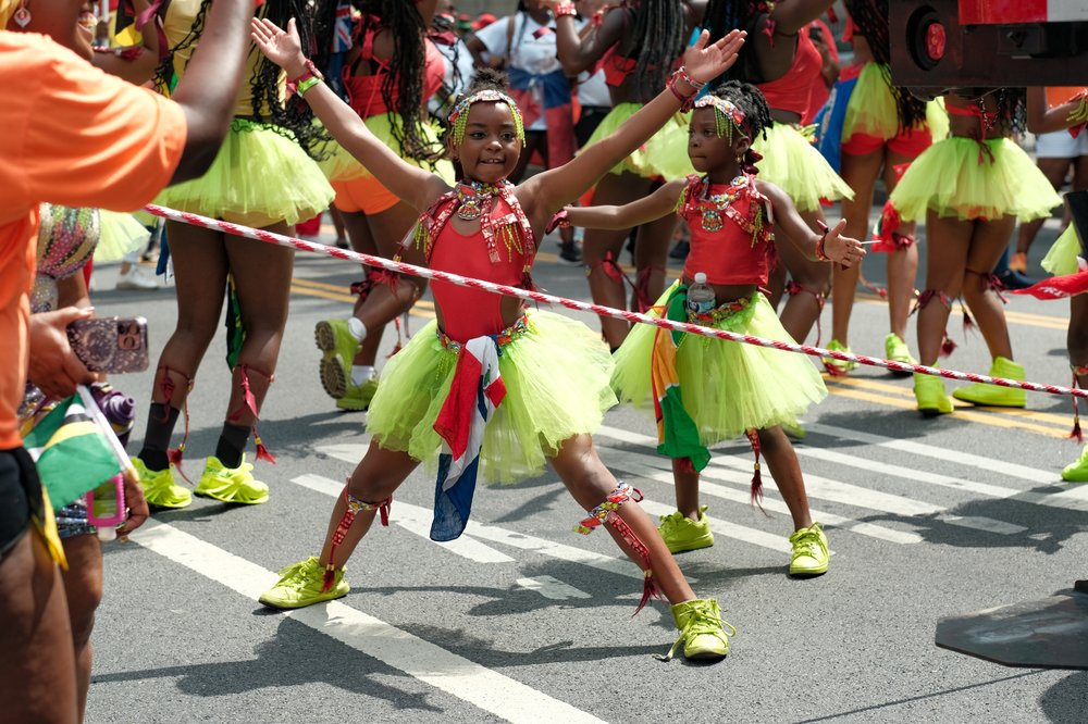 Children dance in the parade.