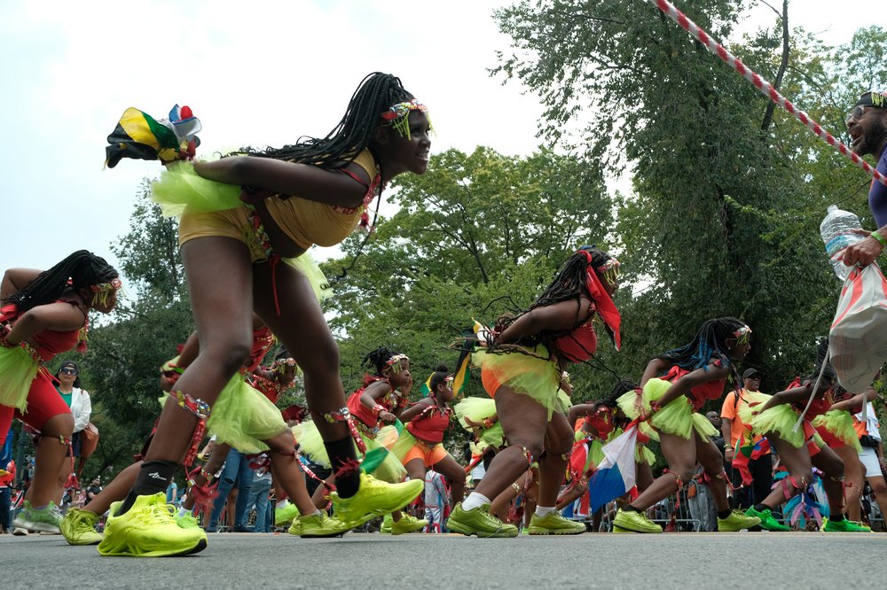 Women dance in the parade.