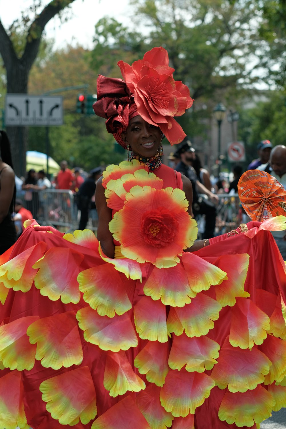 A woman in a colorful flowerlike costume.