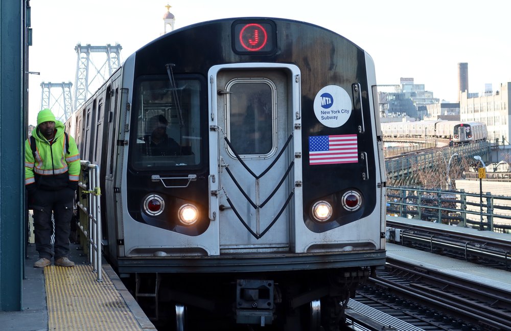 A stock image of a J train in Williamsburg