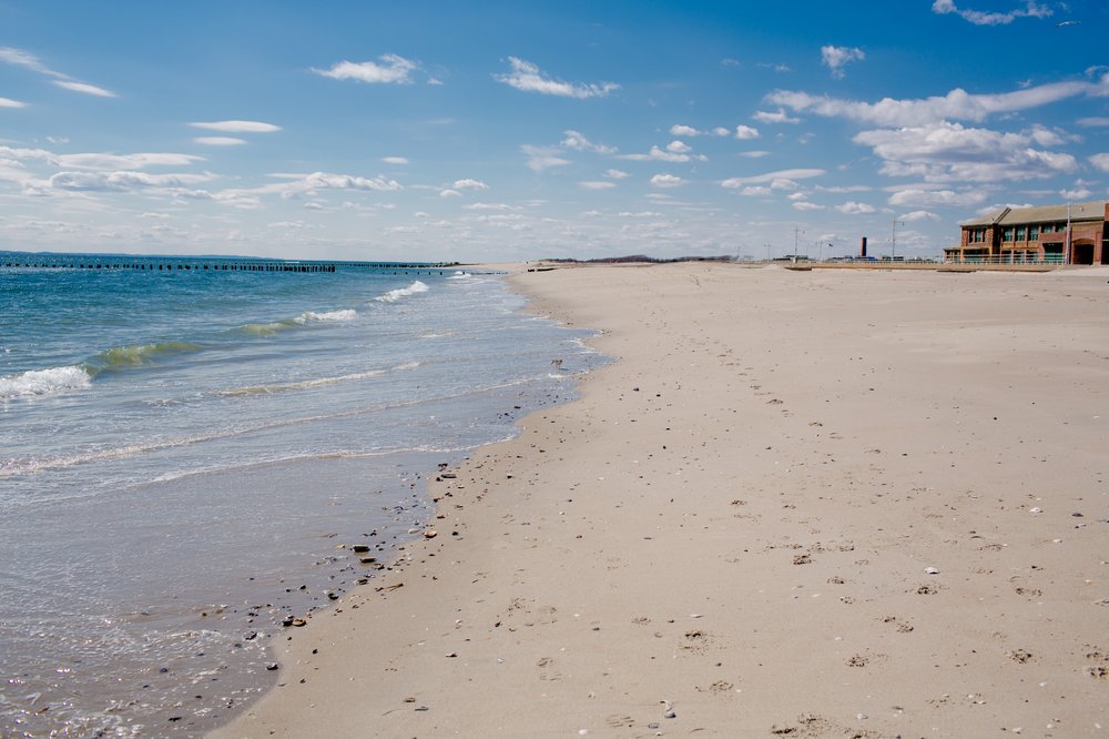 A stock image of the beach at Jacob Riis Park. A 19-year-old man drowned off the coast Friday night, police said.