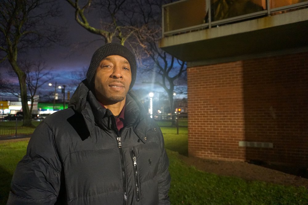 Eric Jenkins standing outside the apartment building he claims he was in during the 1992 shooting of Michael Reese.