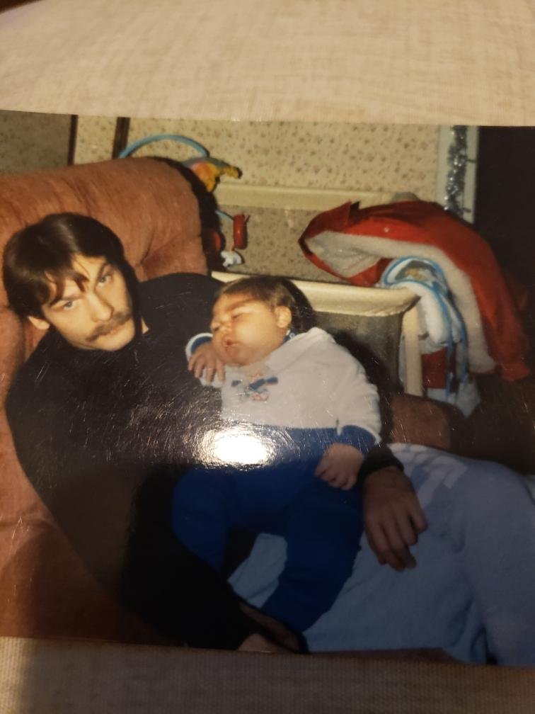 John Henries holding his son Matthew
