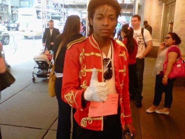 A teenage Jordan Neely wears the a red coat and white glove made iconic by Michael Jackson.