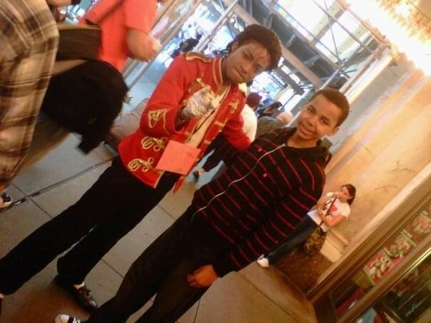 Teenaged Jordan Neely, left, in the red jacket and white glove made famous by Michael Jackson, with Larry Malcolm Smith, Jr.