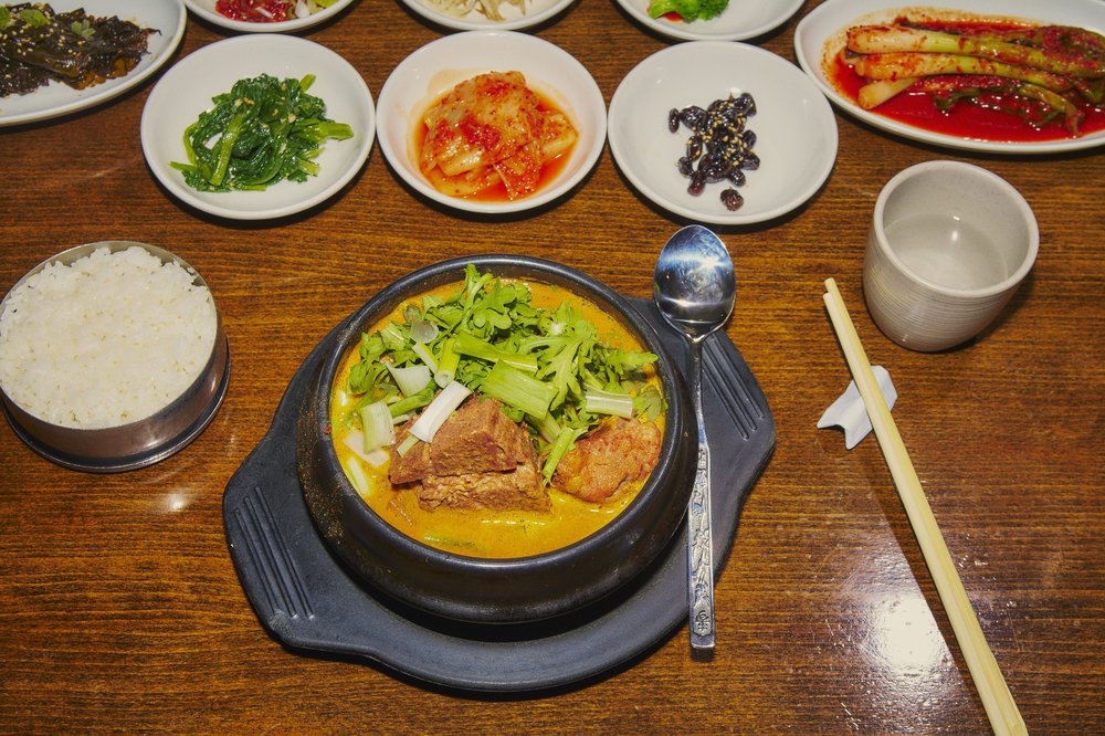 A table full of small plates of food.