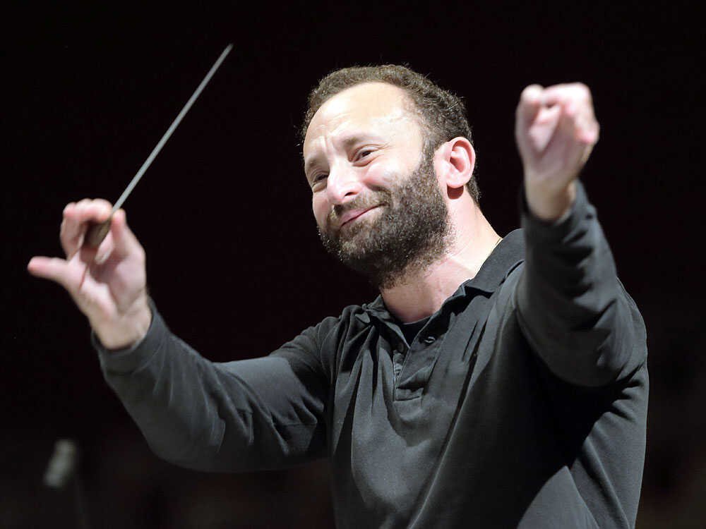 A man waving a conductor's baton.