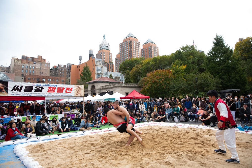 Two wrestlers in a sand pit