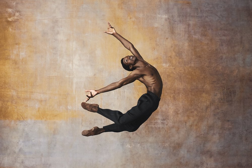 A dancer leaping in midair.
