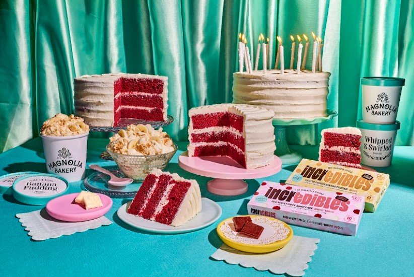 a picture of red velvet cakes on a blue tablecloth against a green curtain.