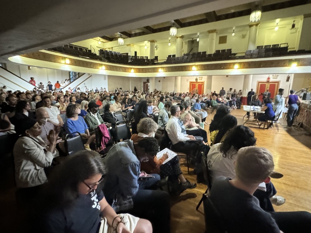 Neighbors of city shelters for migrants in the Clinton Hill section of Brooklyn gather in Brooklyn Masonic Temple to discuss their concerns over the facilities. Nearly 3,900 migrants occupy shelters in the community.