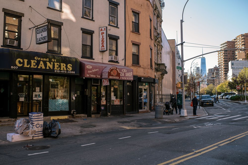 storefronts near the corner of East Broadway and Grand streets