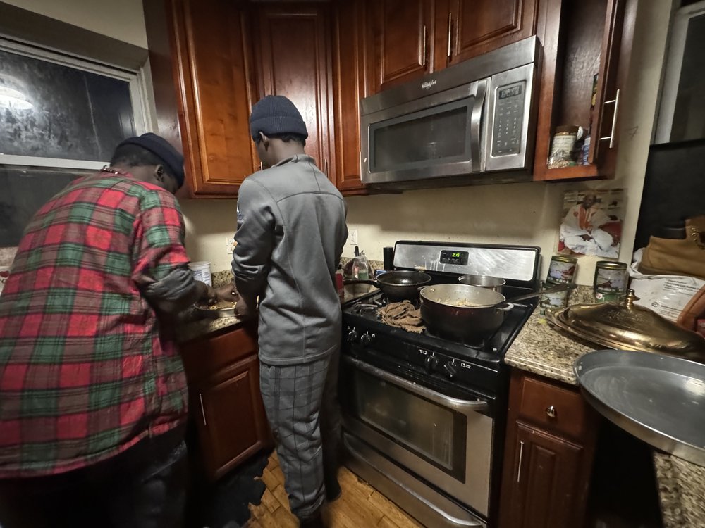 Migrants inside Omar Niass' home