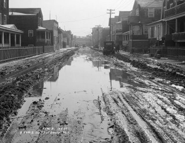NEWOLDROCK05.jpeg "Beach 83rd, south 100 feet of Amstel Boulevard. Muddy and flooded street, houses. December 5, 1927."