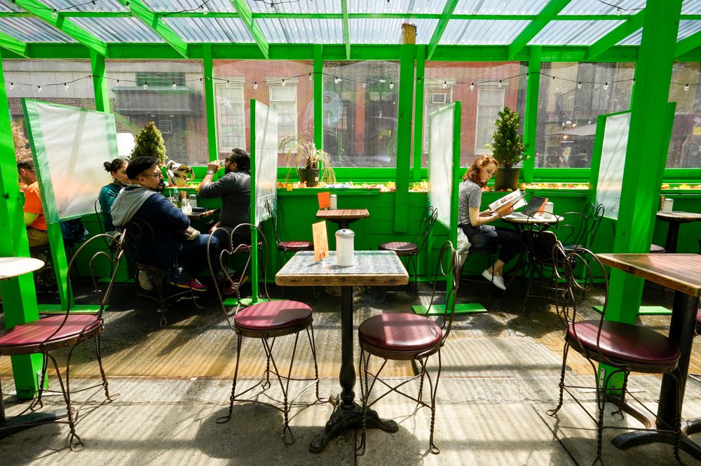 Lunch hour customers are seen in an outdoor seating area of a restaurant in Greenwich Village, May 4th, 2021.