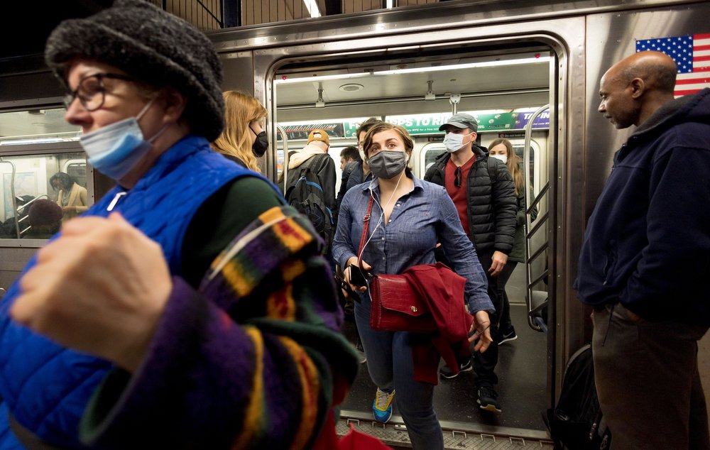 People enter and exit a New York City subway car, April 21st, 2022.