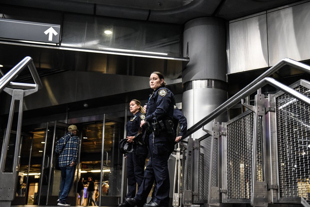 A photo of police patrolling a subway entrance in Manhattan