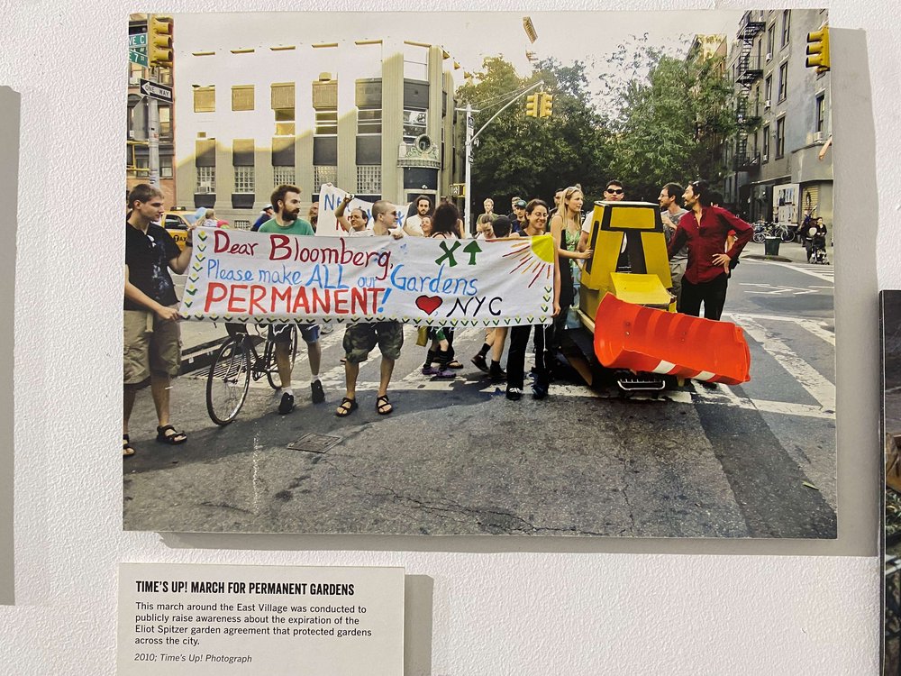 Photo of activists rallying for the preservation of community gardens
